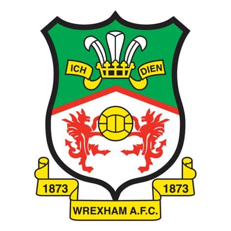 Write informative laconic excerpt under 30 words in mexican spanish for news below. Do not wrap it into quotation marks or html tags. Wrexham forward Paul Mullin has said he sees his long-term future at the club he has helped steer to back-to-back promotions.In an interview with the Guardian, Mullin, 29, said he wishes to remain at League One-bound Wrexham, where he will finish as the team&apos;s top scorer for a second straight season on Saturday.- Stream on ESPN+: LaLiga, Bundesliga, more (U.S.)"I&apos;m here for the next two years. The fans love me, I love them and everything about the club," Mullin said."If another club made an offer and Wrexham accepted it, then I&apos;m in a position where they&apos;re telling me to go. It&apos;s not something I&apos;m looking for or would wish to happen. It&apos;s quite the opposite. I&apos;d love to play in the Premier League for Wrexham. That&apos;s the pipe dream."It&apos;s also the owners&apos; dream to one day become a Premier League club. Who knows whether that takes 10 or 20 years? 50 years or five years? Ryan and Rob are really ambitious and phenomenally successful in all they do. In football they don&apos;t want it to be any different. They want to keep going and get us promoted again."Mullin, whose existing contract runs until 2026, has 24 goals in 37 league games this season, the second highest total in the league.Wrexham face League Two champions Stockport County on Saturday in their final game of the season.The club will travel on their second preseason tour of the United States and Canada in July. ,Paul Mullin desea permanecer a largo plazo en el Wrexham, donde ha contribuido a dos ascensos consecutivos. Terminará como máximo goleador del equipo por segundo año seguido.